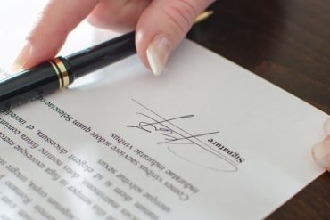 Prenup being signed