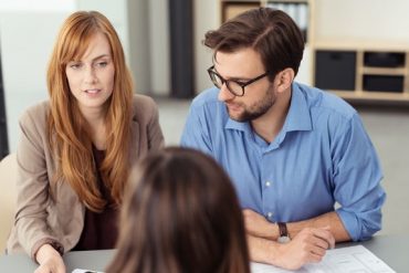 Young couple discussing prenuptial agreement